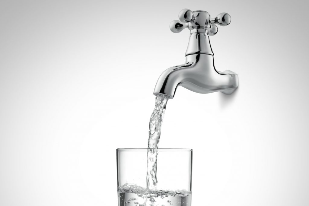 filling a glass of water from tap