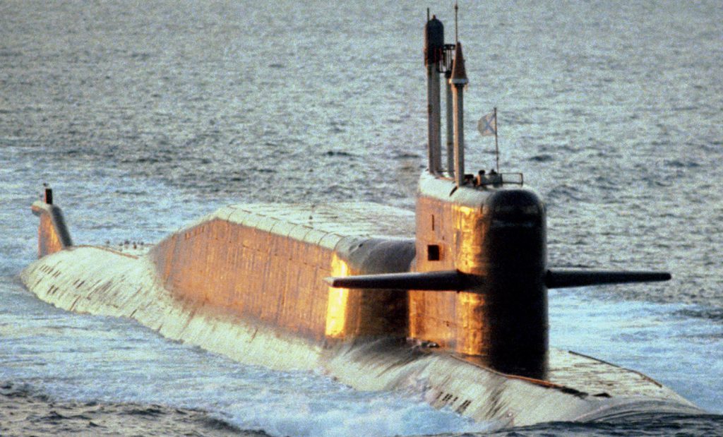 An aerial starboard bow view of  a  Russian Navy Northern Fleet DELTA IV class nuclear-powered ballistic missile submarine underway on the surface.